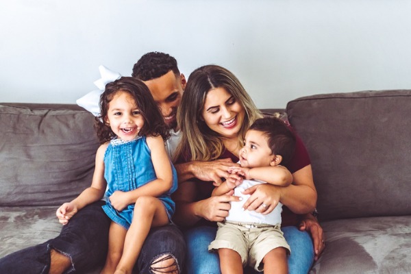 Parents holding young children on their lap